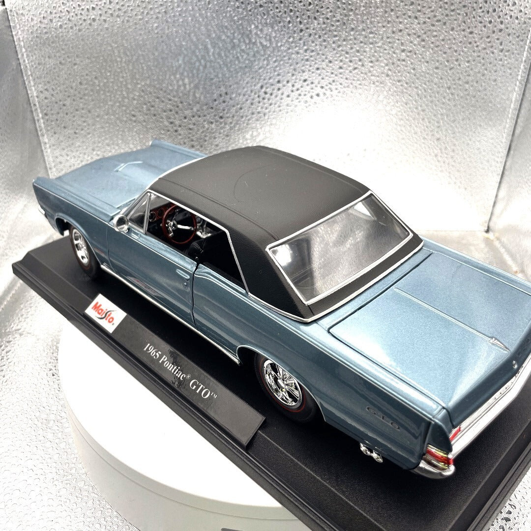 Maisto 1965 Pontiac GTO Blue Die Cast with Base, Scale: 1/18 driver's side/rear view