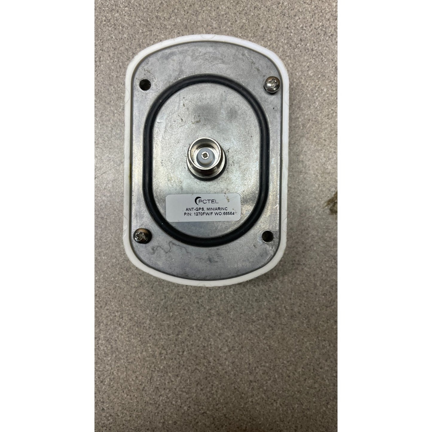 PCTEL 1270FW/F ANT-GPS Mini Arinc Antenna back of unit with connection and product label