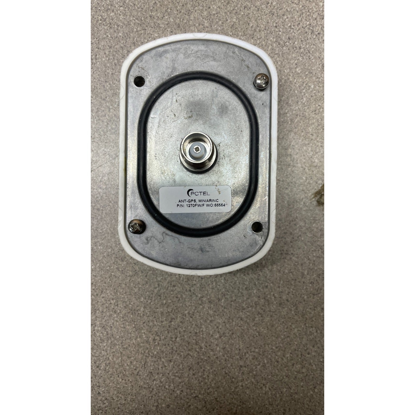 PCTEL 1270FW/F ANT-GPS Mini Arinc Antenna back of unit with connection and product label