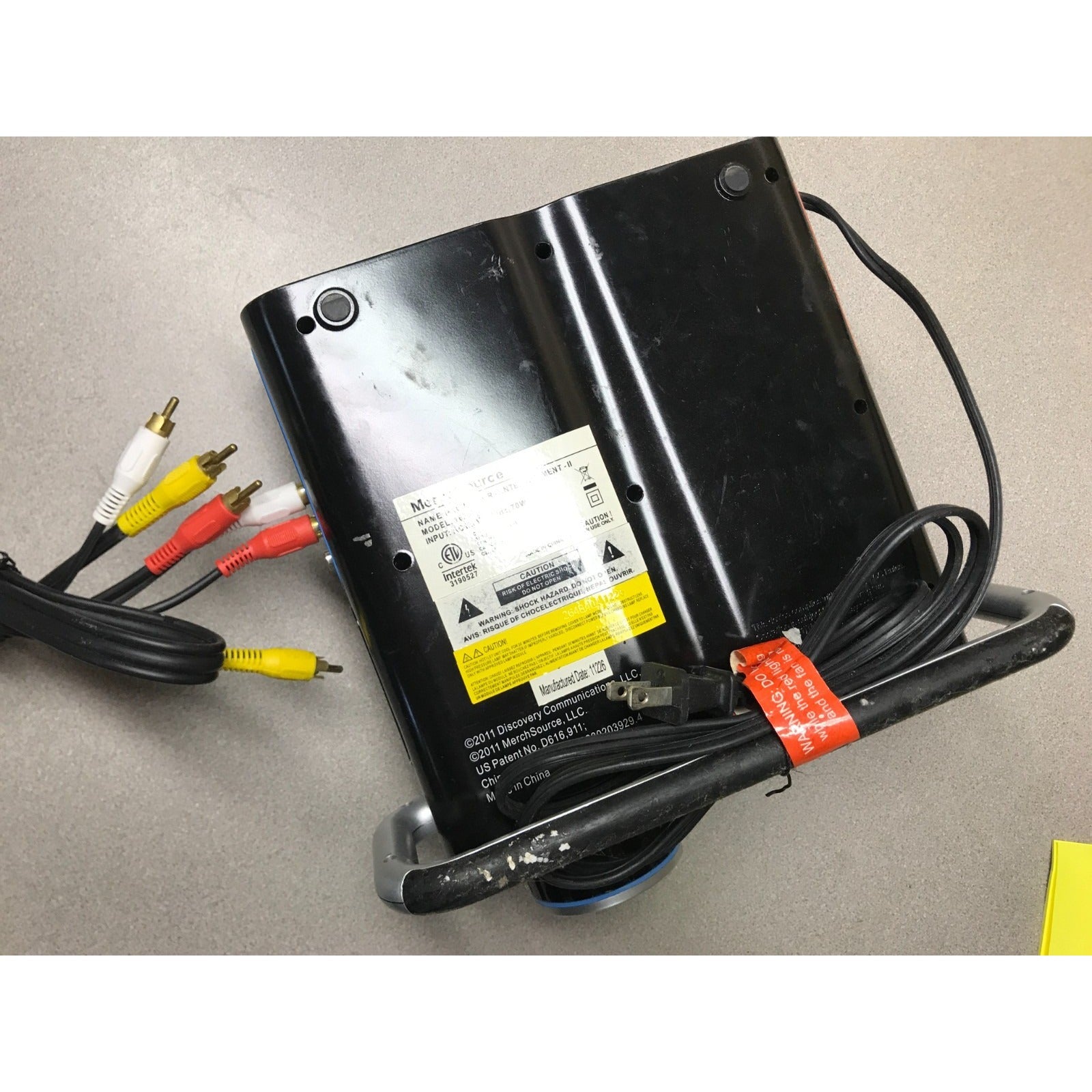 Discovery Wonderwall Expedition Entertainment LCD Projector Model 1625075 bottom view with product label and cables