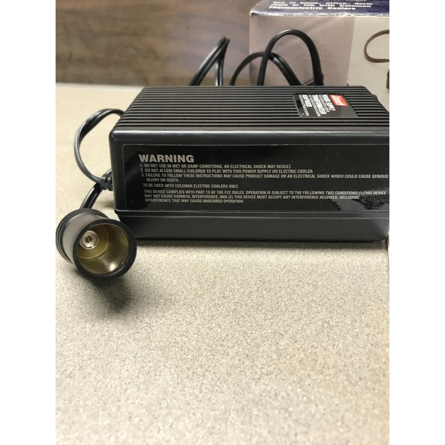 Coleman 120-V AC Adaptor, Converts to 12 Volts DC (5.25 amps), 5232E640T closeup of power side and adapter