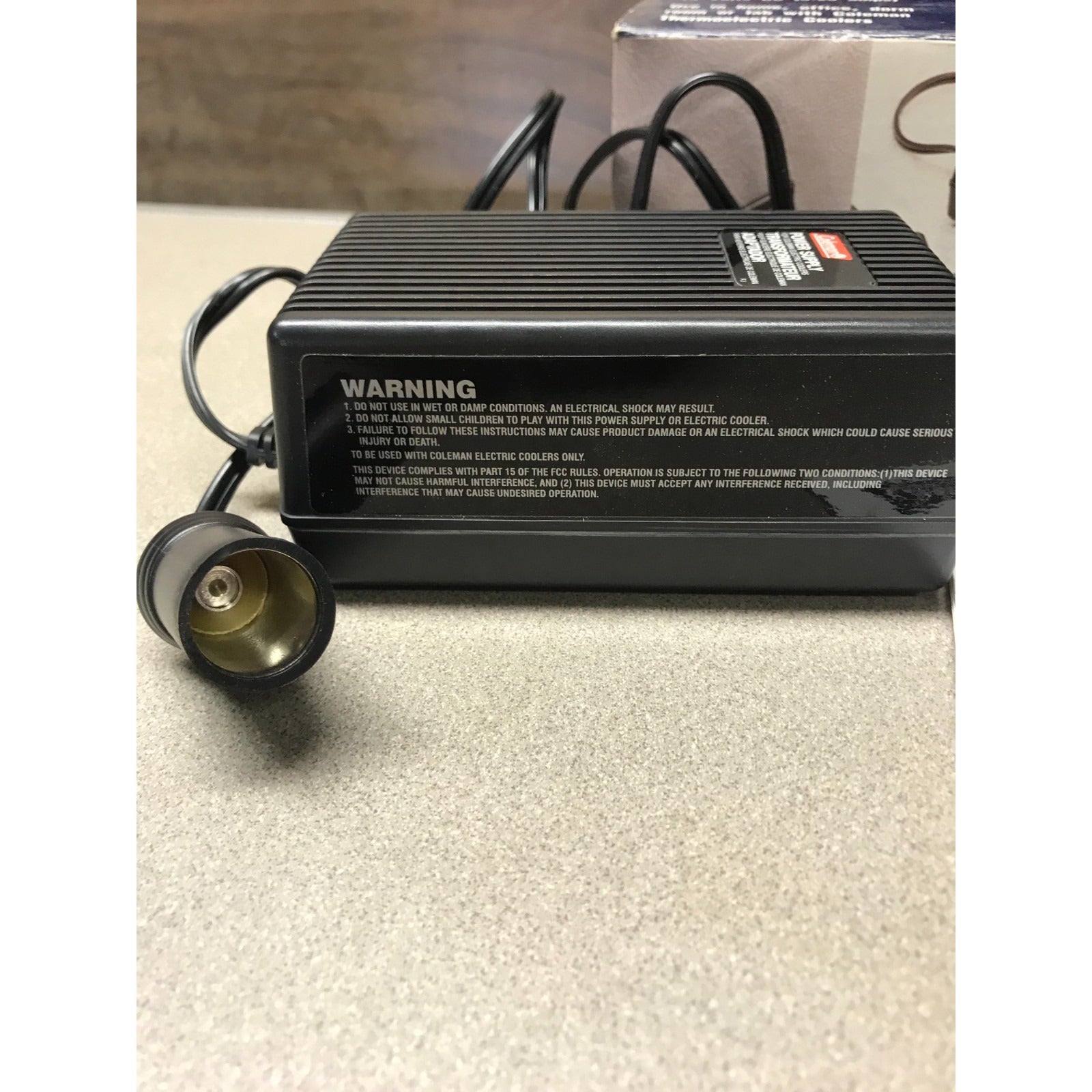 Coleman 120-V AC Adaptor, Converts to 12 Volts DC (5.25 amps), 5232E640T closeup of power side and adapter
