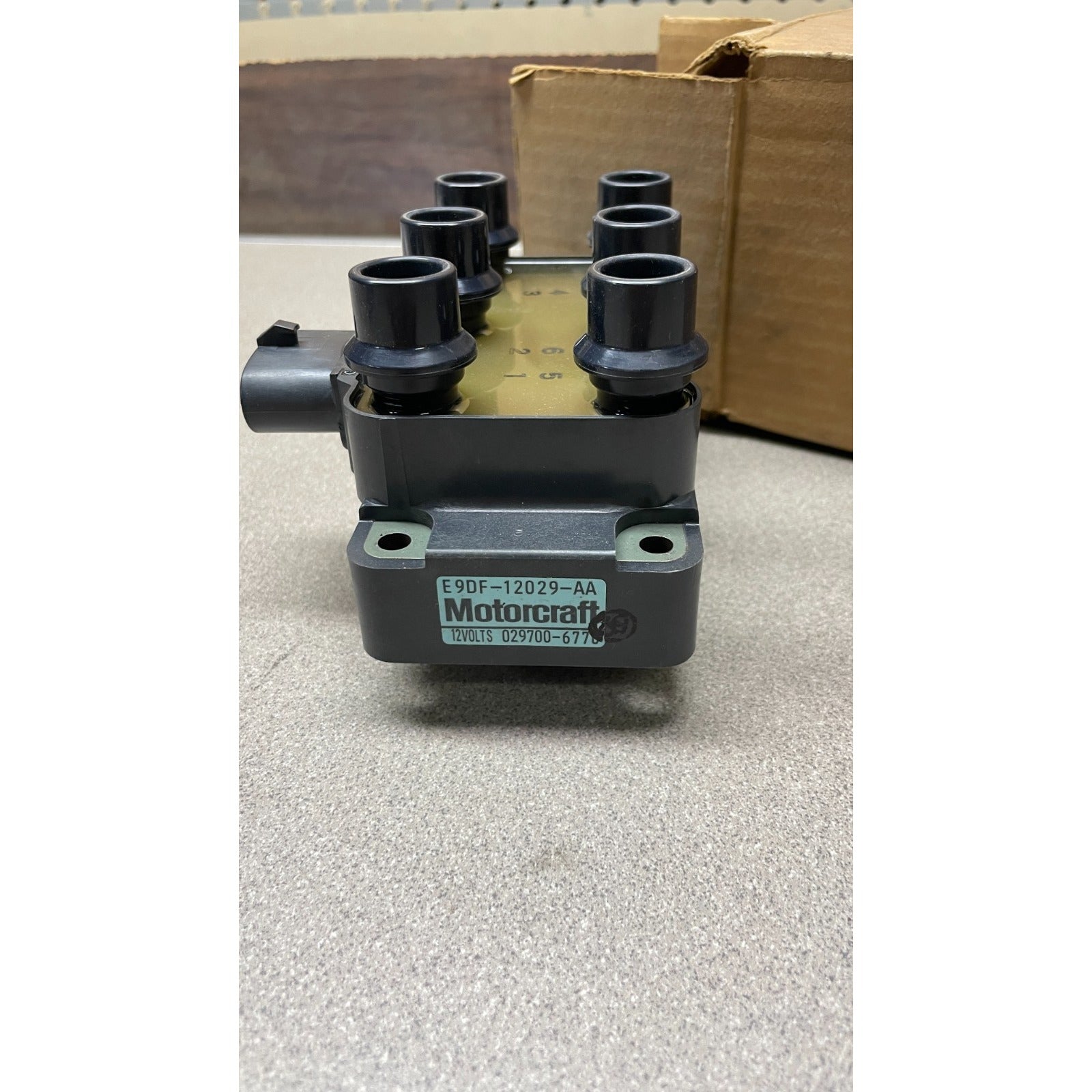 Motorcraft FORD 12 Volt Ignition Coil, part E9DF-12029-AA, 029700-6770 side view with label showing part number 