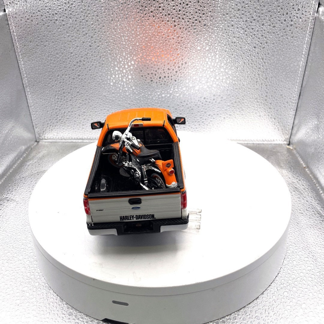 Maisto 2010 Ford F-150 STX Harley Davidson Die Cast with Motorcycle, Scale: 1/27, No. 01618 back end/trunk bed view with motorcycle