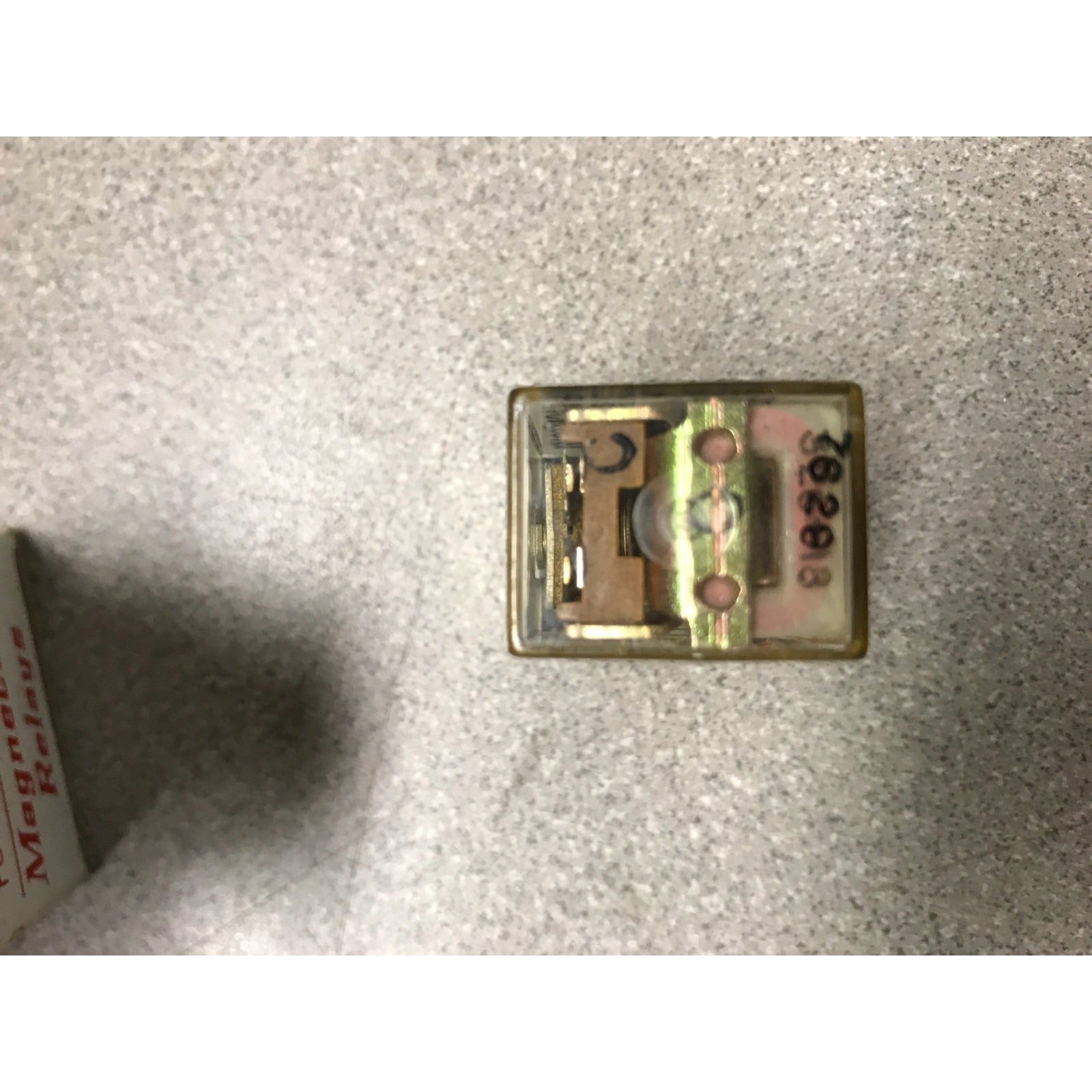 Magnecraft Relay W67CSX-1, Nom. Volts=6, Res. OHMs=52, Cont. Rating =3A side view of relay