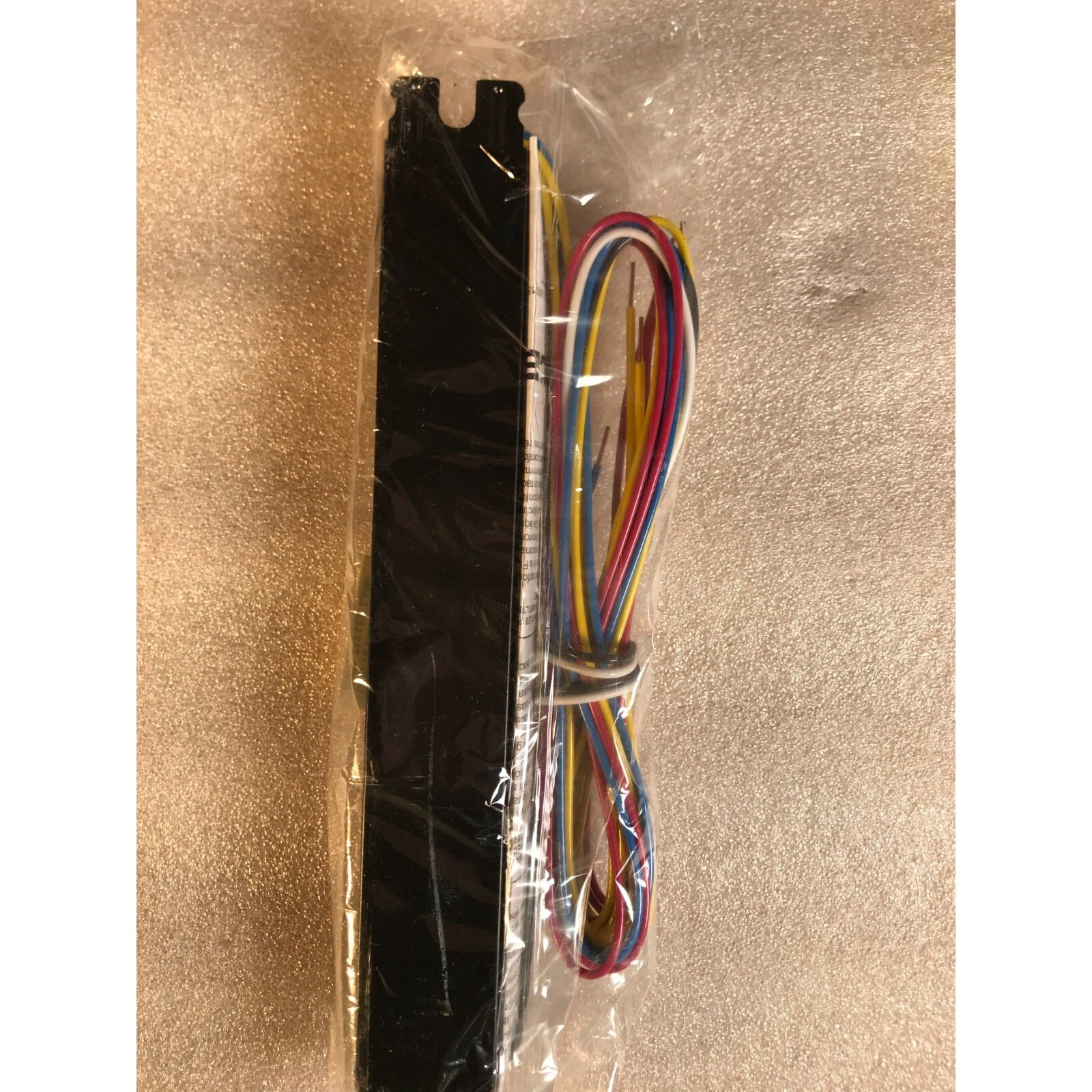 Philips Advance 120V to 277V Power Adapter side view in packaging