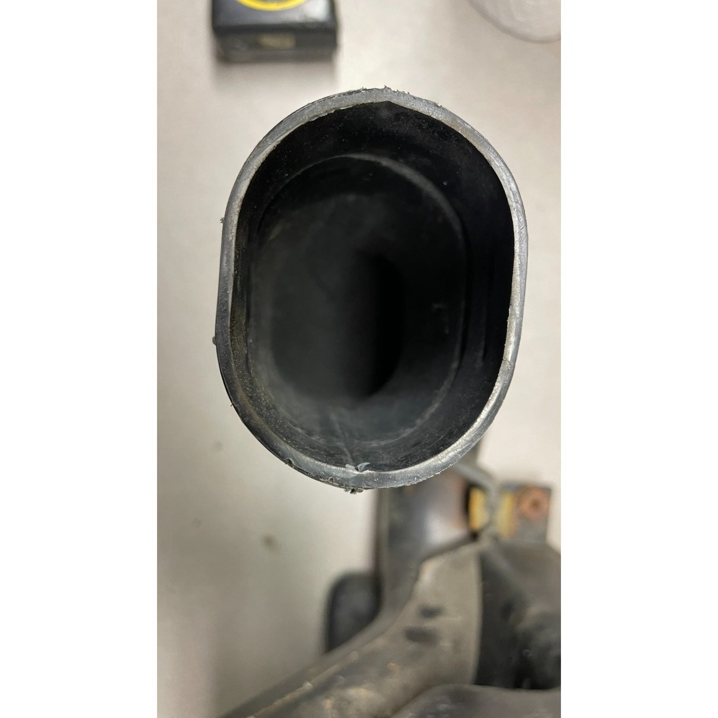 OEM Honda Civic Del Sol Intake Resonator Box closeup of exhaust pipe