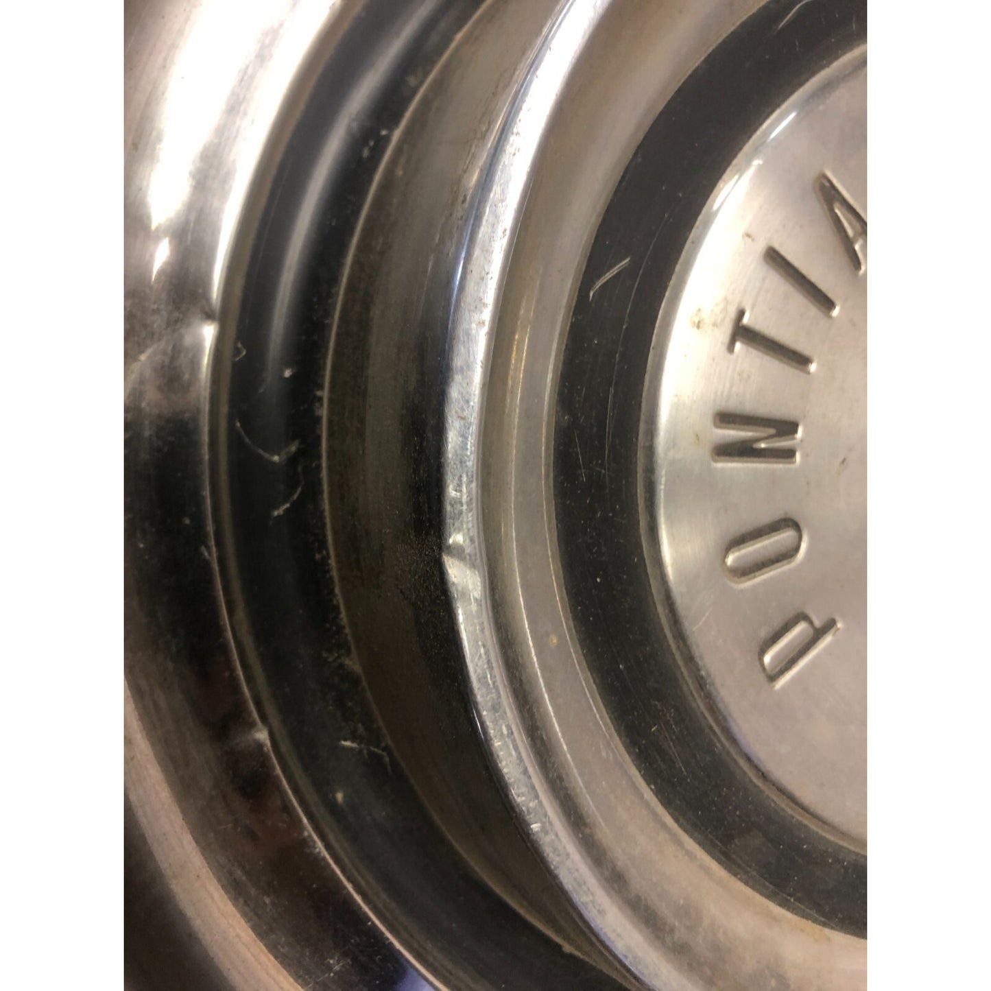 Pair 1958 Pontiac Hub Cap Wheel Cover 14in front view small dent closeup