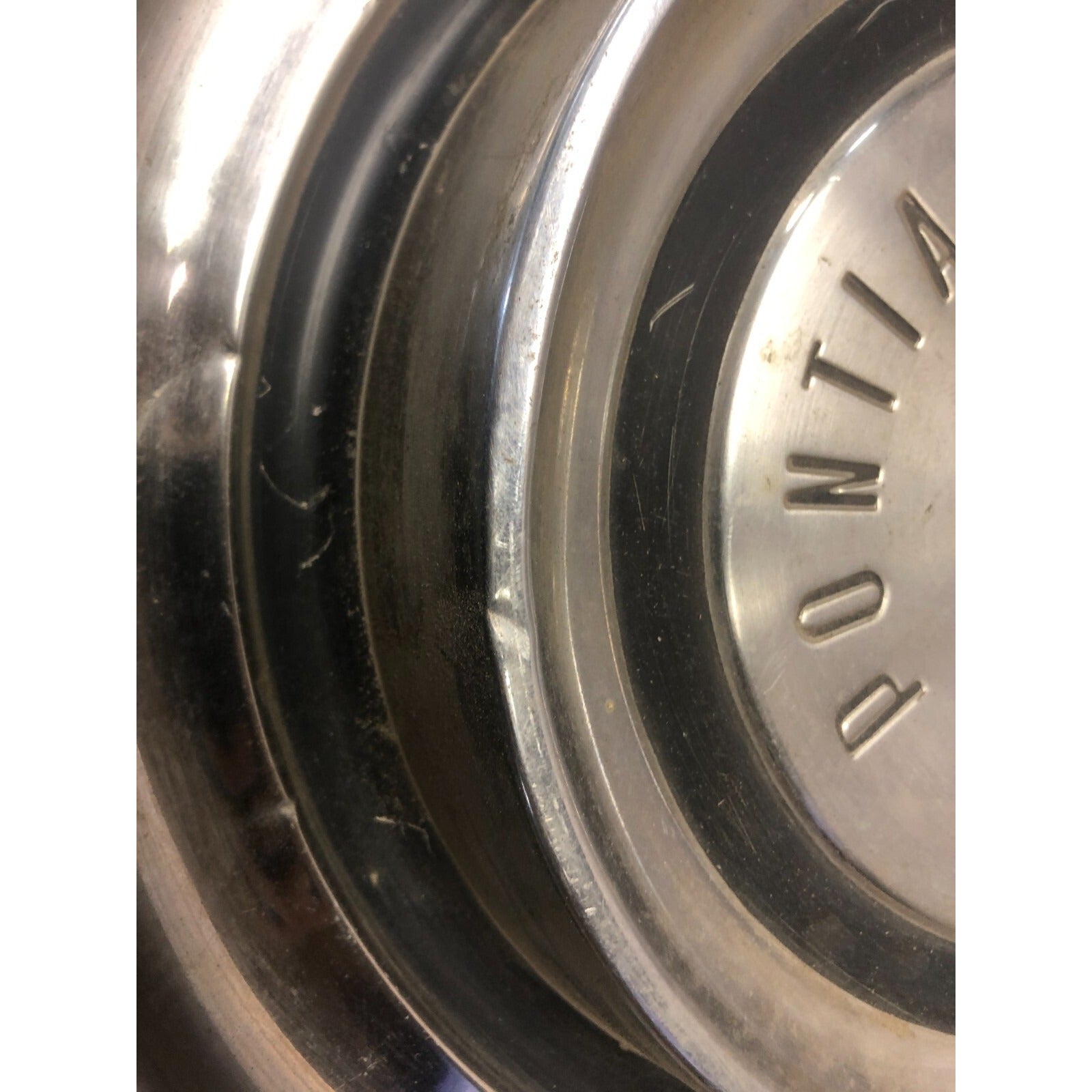 Pair 1958 Pontiac Hub Cap Wheel Cover 14in front view small dent closeup