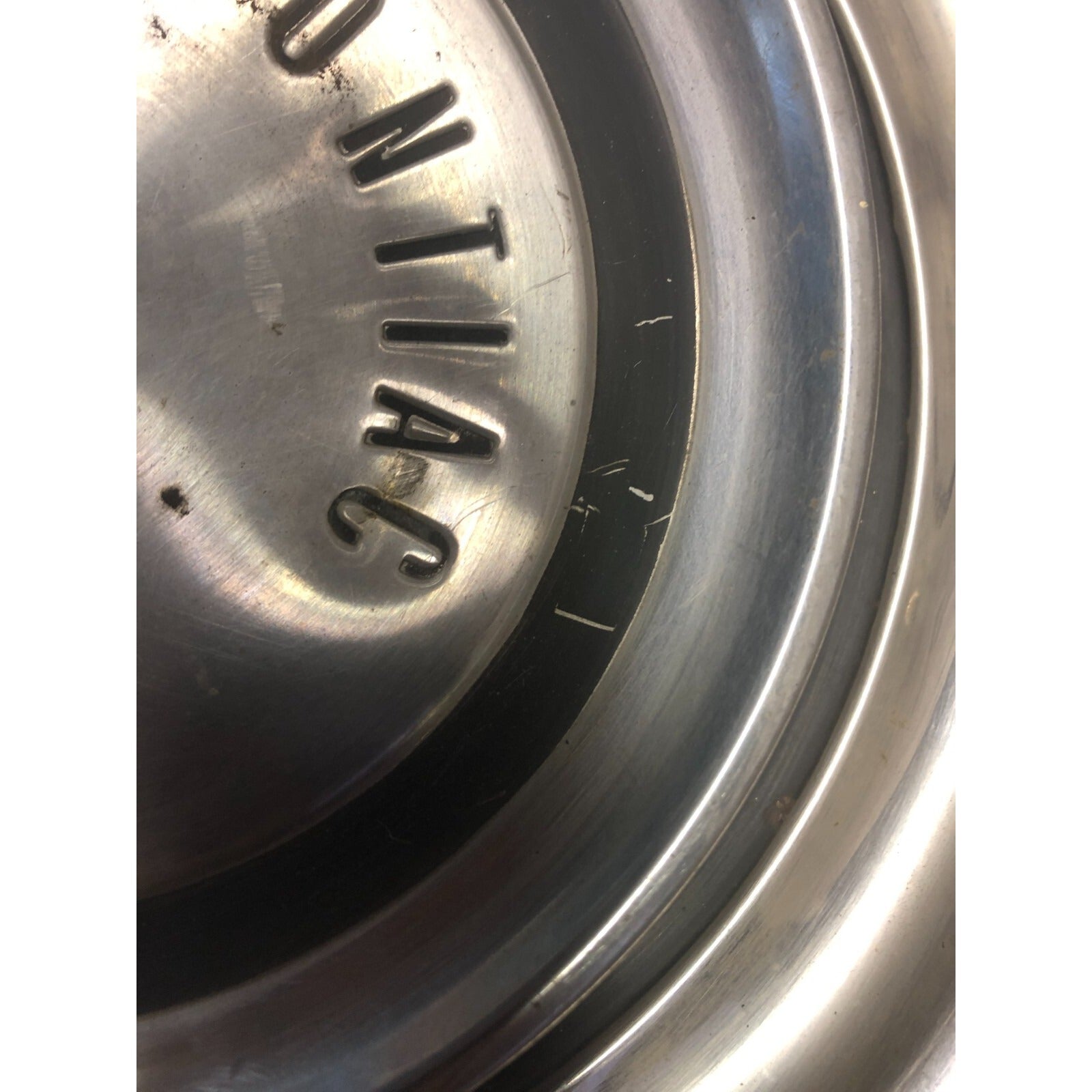 Pair 1958 Pontiac Hub Cap Wheel Cover 14in front view closeup small dent