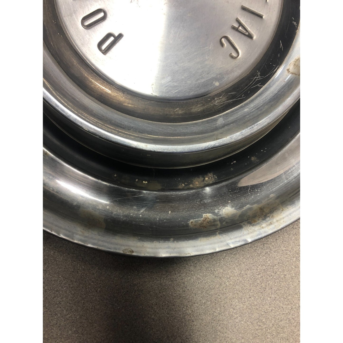 Pair 1958 Pontiac Hub Cap Wheel Cover 14in front view close up imperfection