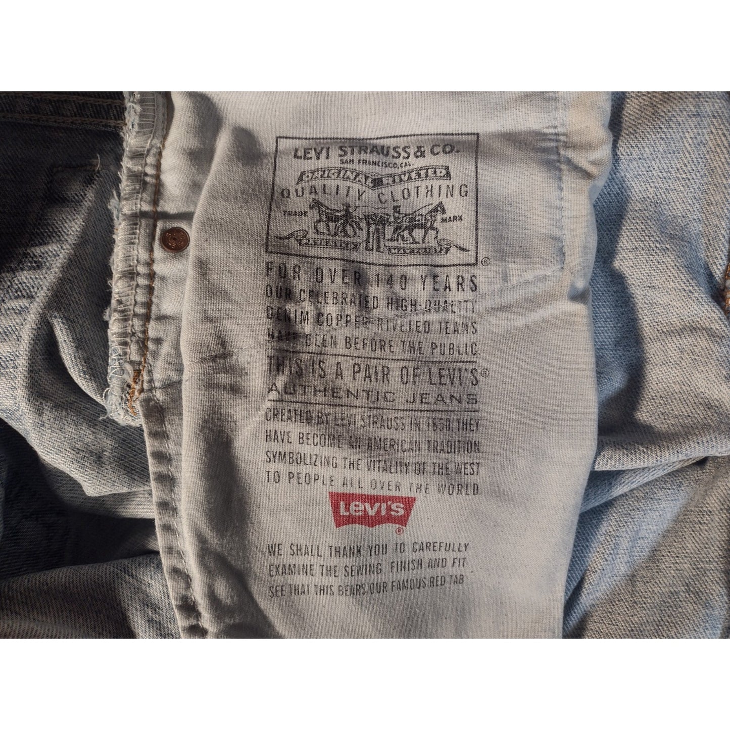 Levi's Strauss &amp; Co Light Blue Jeans Relaxed Fit Tapered Leg W34 L32 inside product stamp history of Levi's
