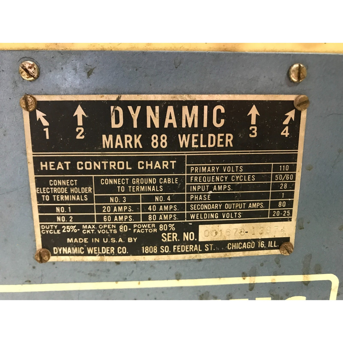 A close-up of a metal product label for a Dynamic Welder Mark 88 Welder, showing a heat control chart with connection instructions and technical specifications.