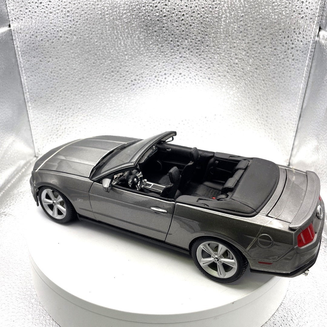 Maisto 2010 Ford Mustang GT Grey Die Cast, Scale: 1/18, No. 11633 drivers side/back end view