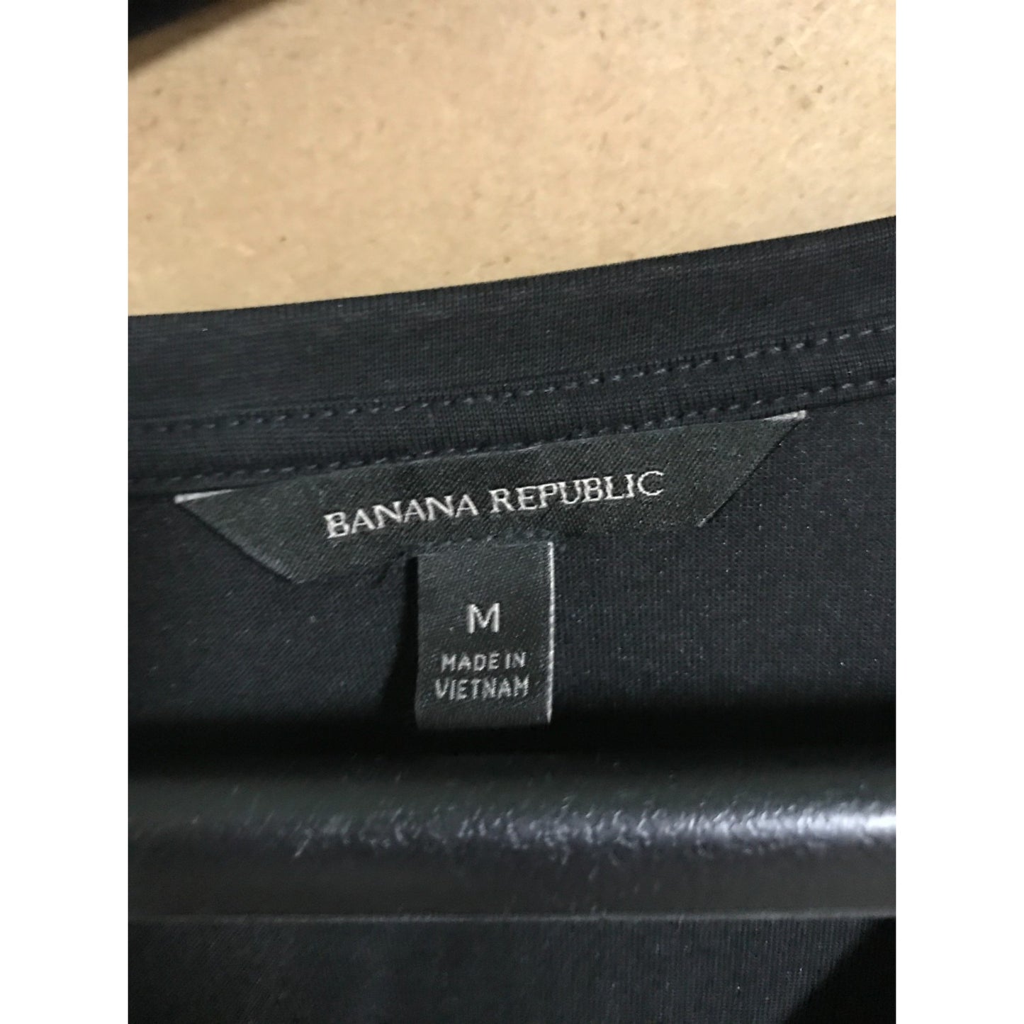 Black fabric with Banana Republic label and 'Made in Vietnam' tag