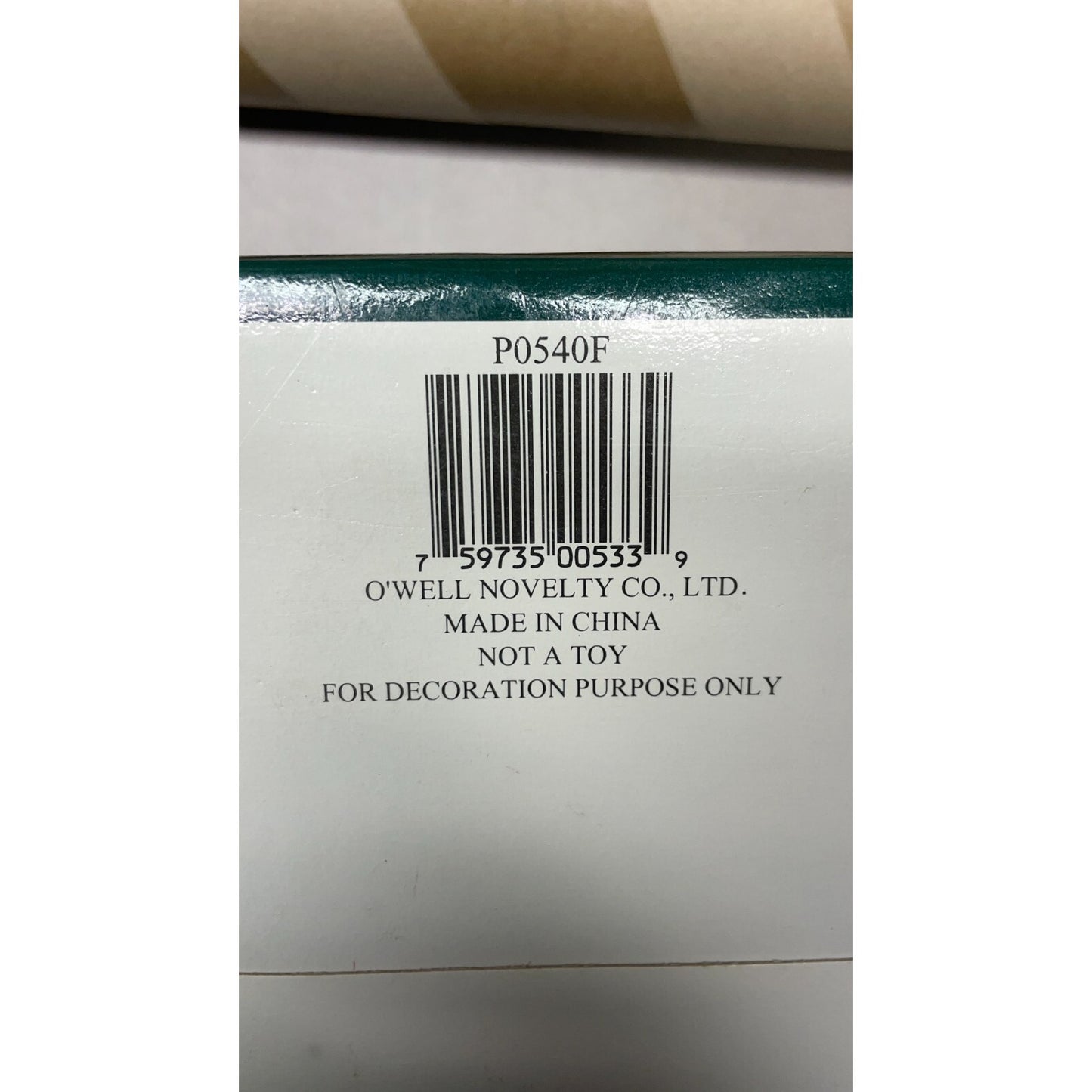 Back of a product packaging with a barcode and text on a white background