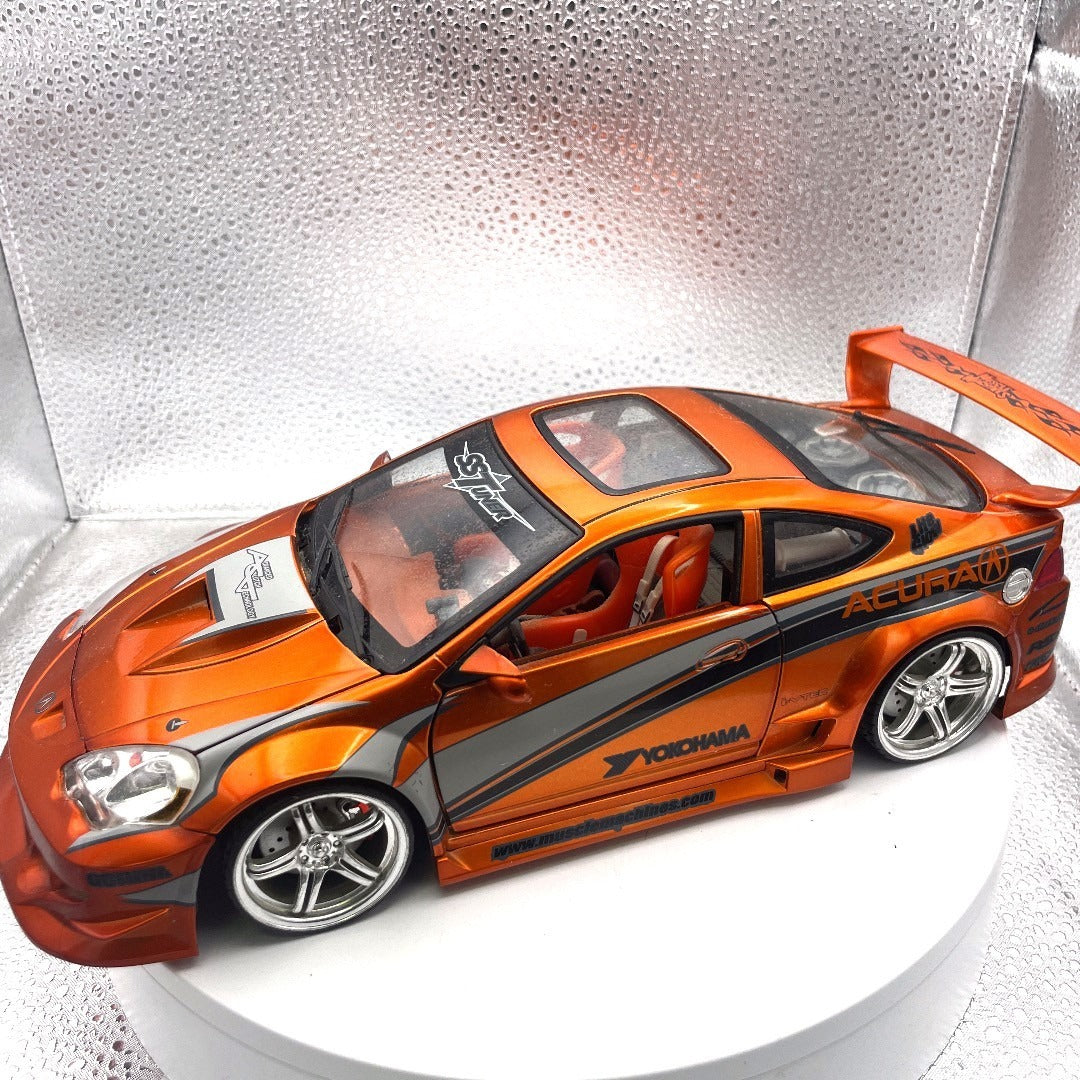 Muscle Machines 2002 Acura RSX Orange Die Cast, 1:18 Scale drivers side view