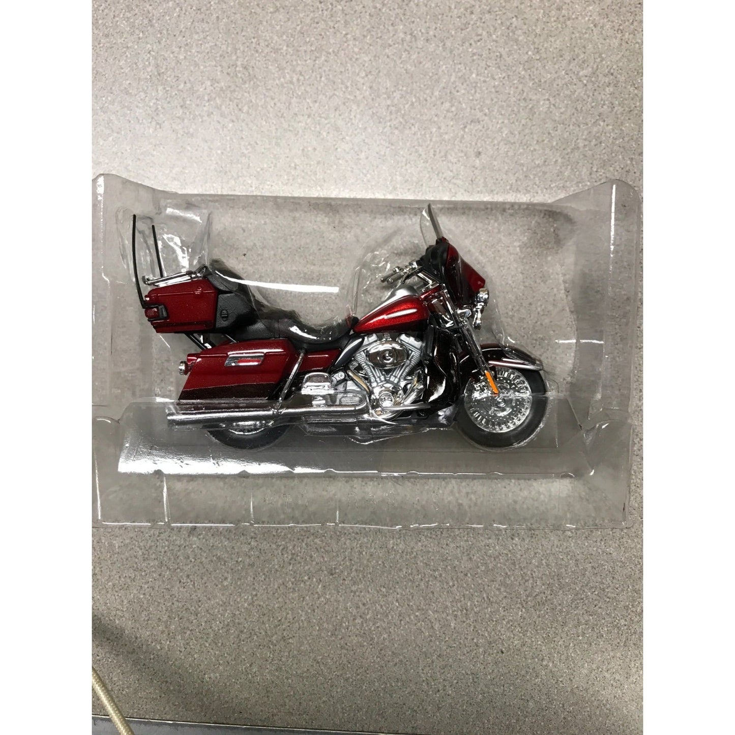 Maisto Harley Davidson Die Cast Lot of 8, 6 Brand New In Plastic closeup of red motorcycle in plastic case