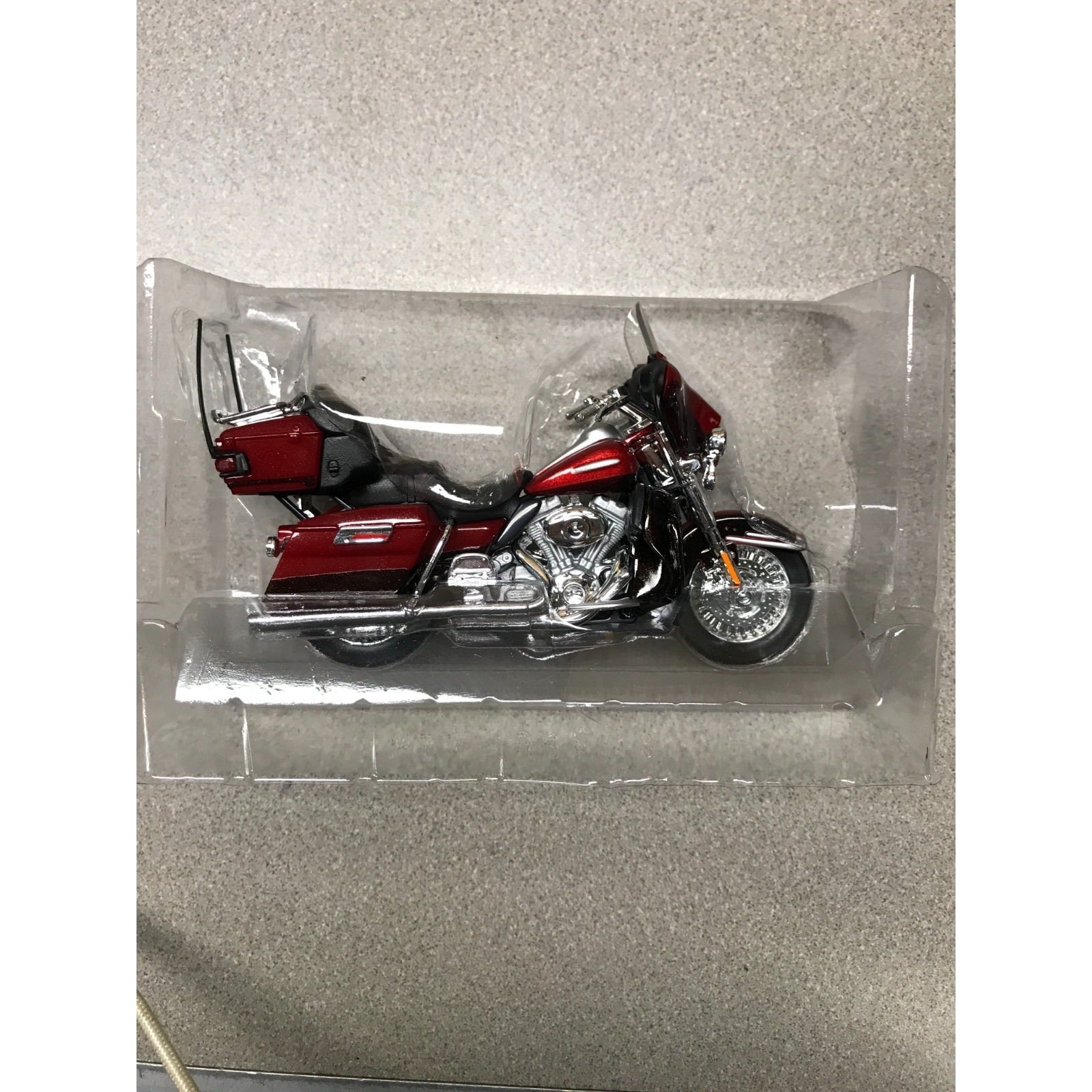 Maisto Harley Davidson Die Cast Lot of 8, 6 Brand New In Plastic closeup of red motorcycle in plastic case