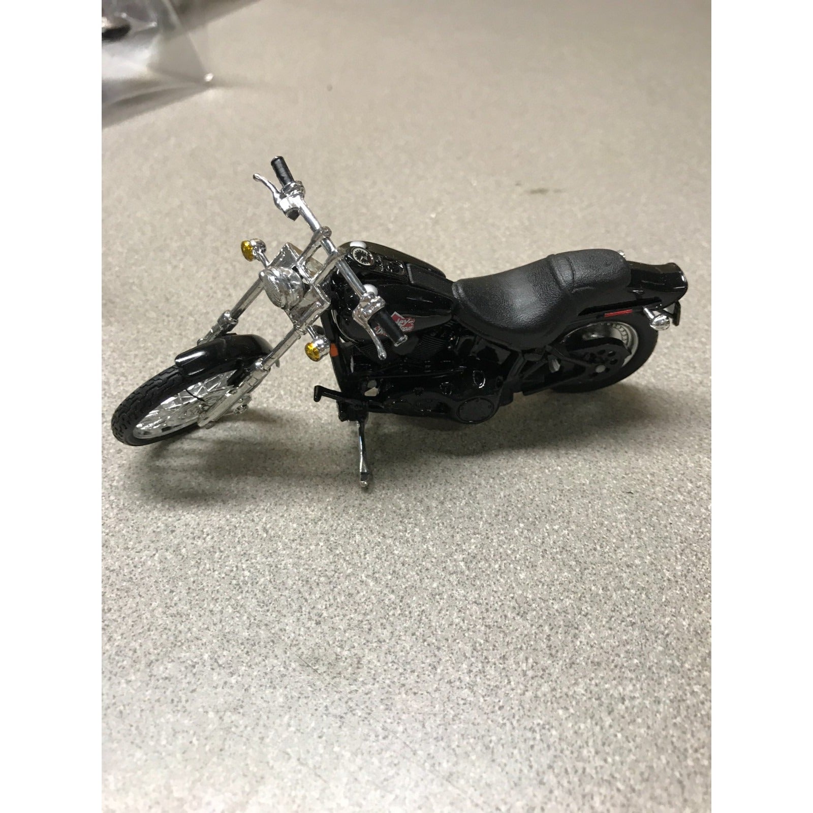 Maisto Harley Davidson Die Cast Lot of 8, 6 Brand New In Plastic closeup of black motorcycle