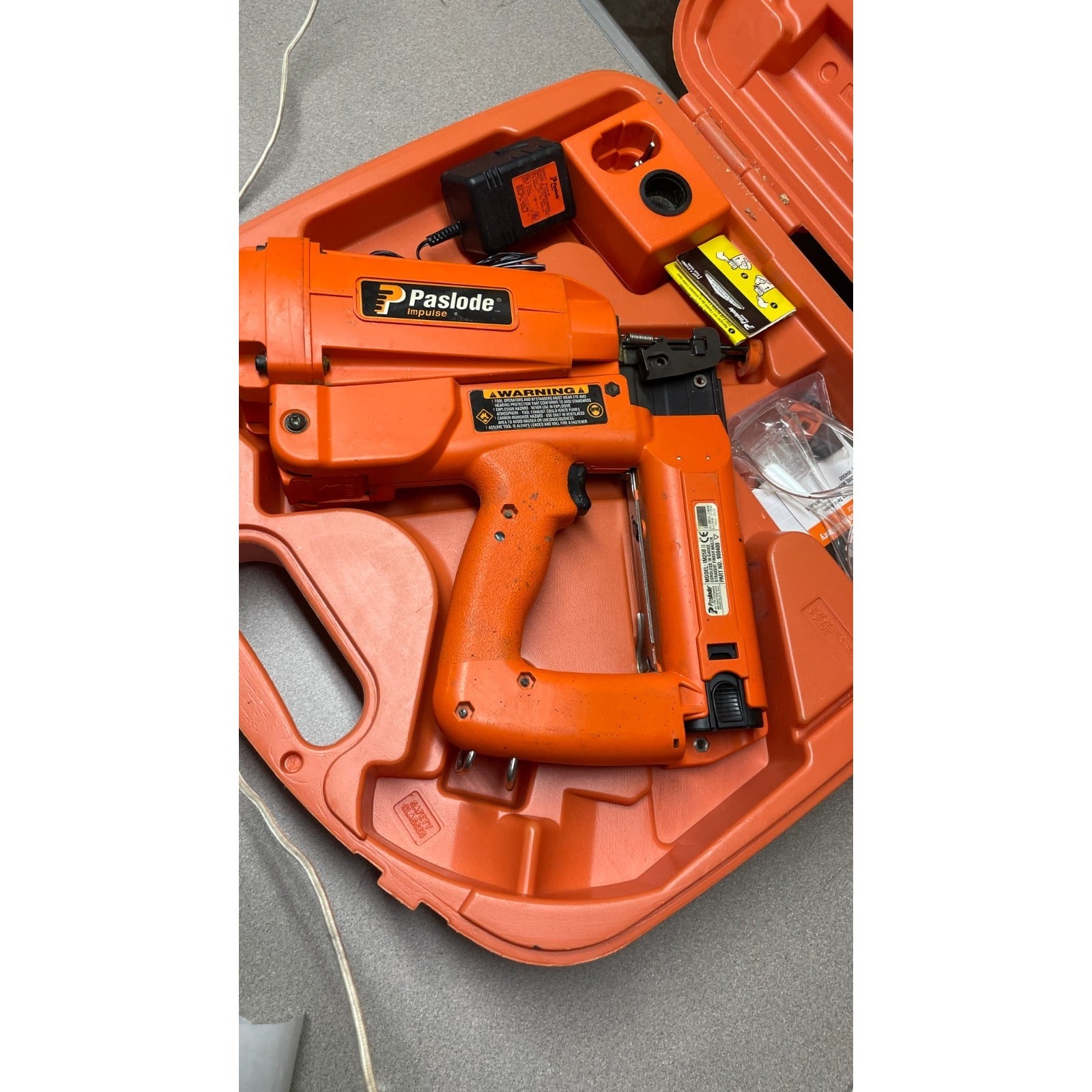 Paslode Impulse IM250 II Cordless 16 gauge Straight Finish Nailer 900400, Untested, Includes Case and Accessories view of nail gun in case with accessories