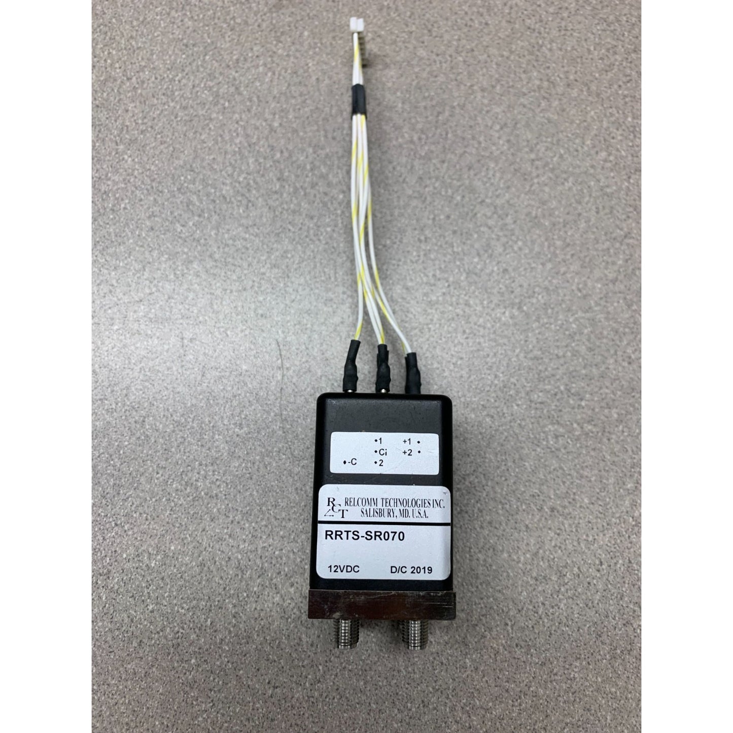 Transfer Relay Relcomm Technologies RRTS-SR070 12VDC w/SMA Connectors top view of relay with wires and connector product label