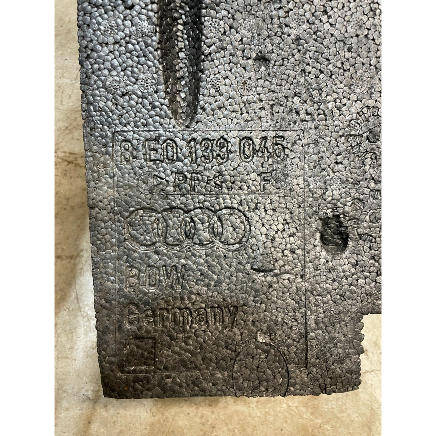 AUDI FRONT RIGHT PASSENGER DAMPER PAN LINER FOAM LINING PAD PANEL OEM closeup of product stamp