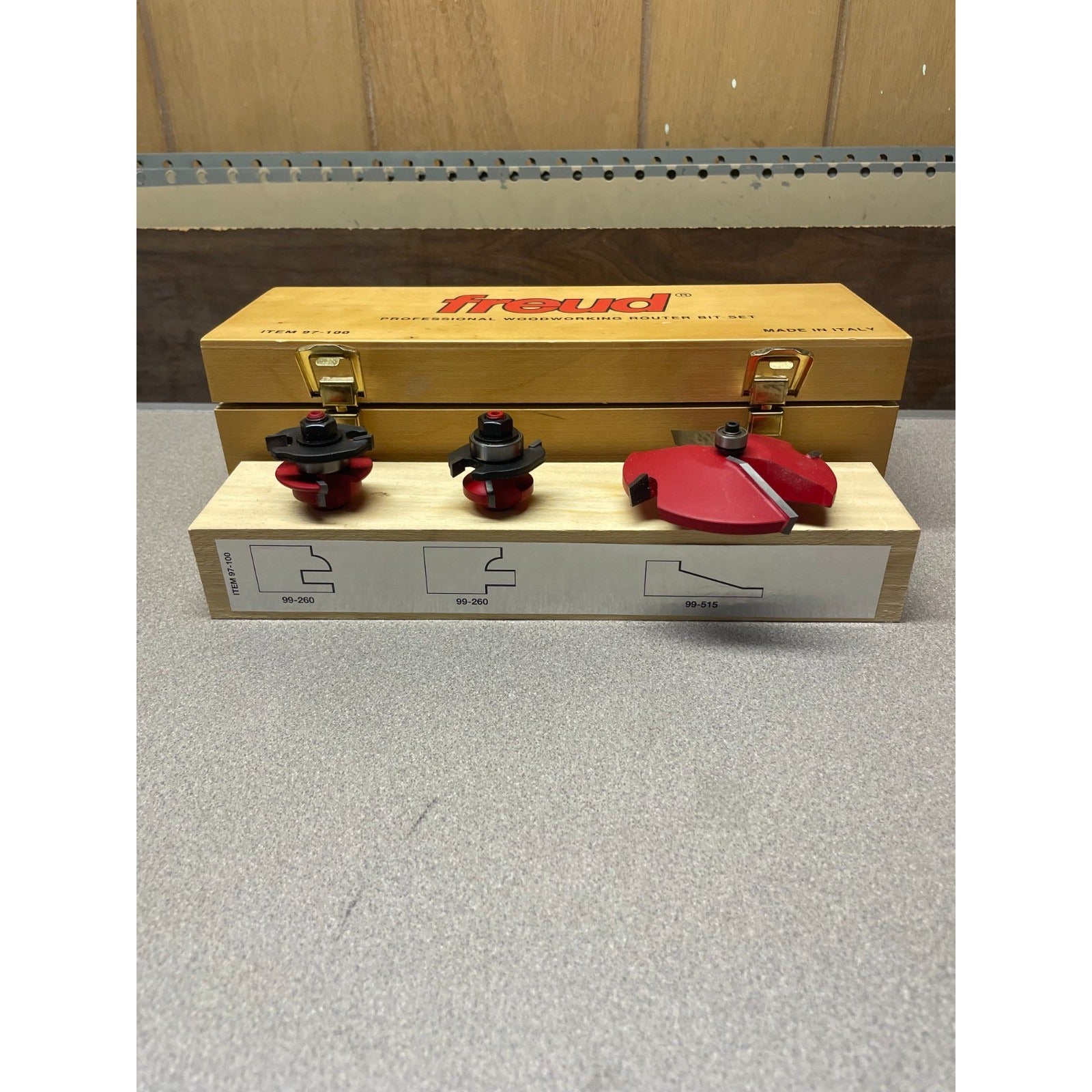 Freud Router Bit Set ITEM 97-100, Like New router bits on top of storage container with side view of bit