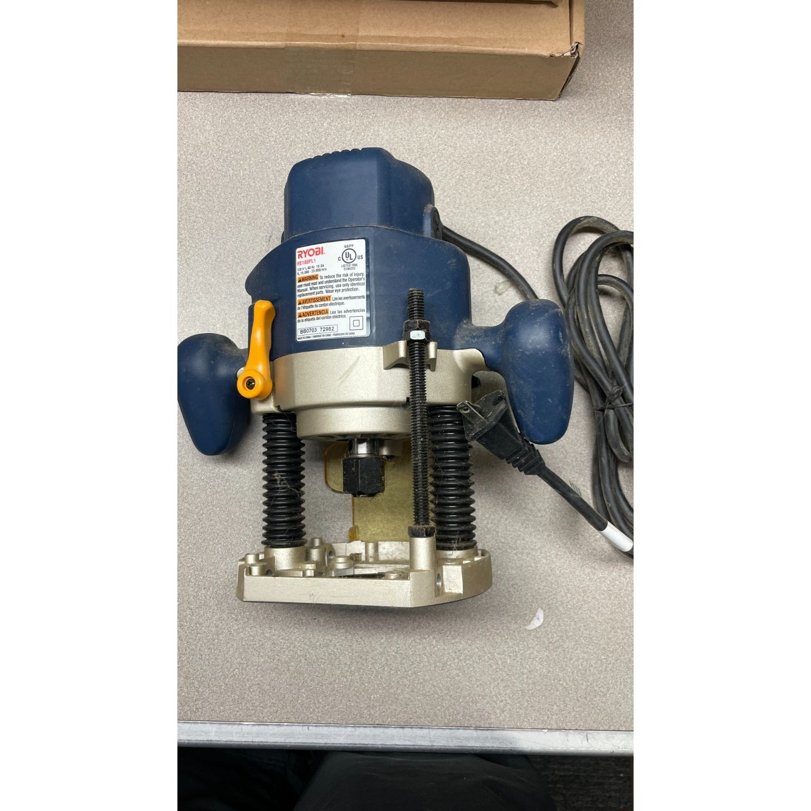 Ryobi Corded Electric 2 HP Variable Speed Plunge Router back view of router with product label